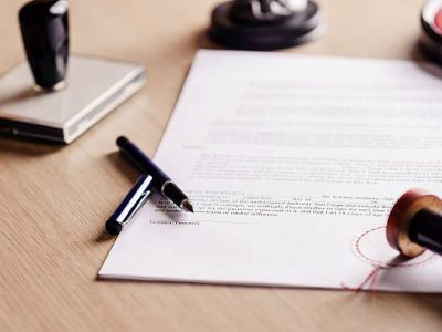 Notary pen lying on testament. Notary public working accesories